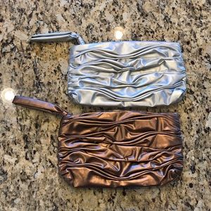 NWOT 2 metallic clutches